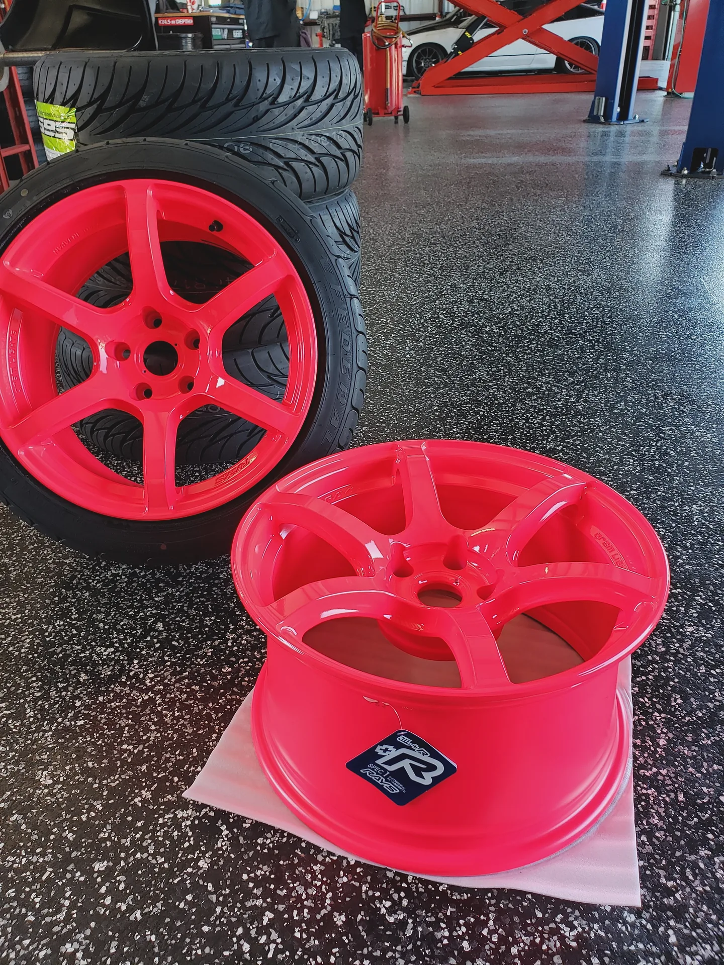 Custom powder-coated pink wheels ready for installation