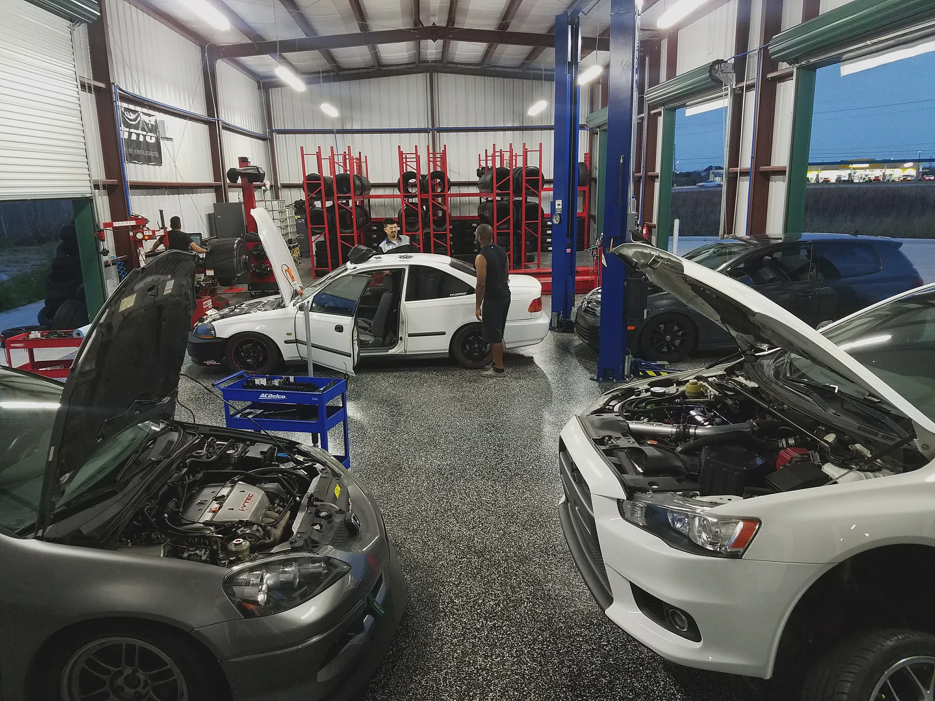 Customer vehicles lined up for service at VIBE Auto Sports